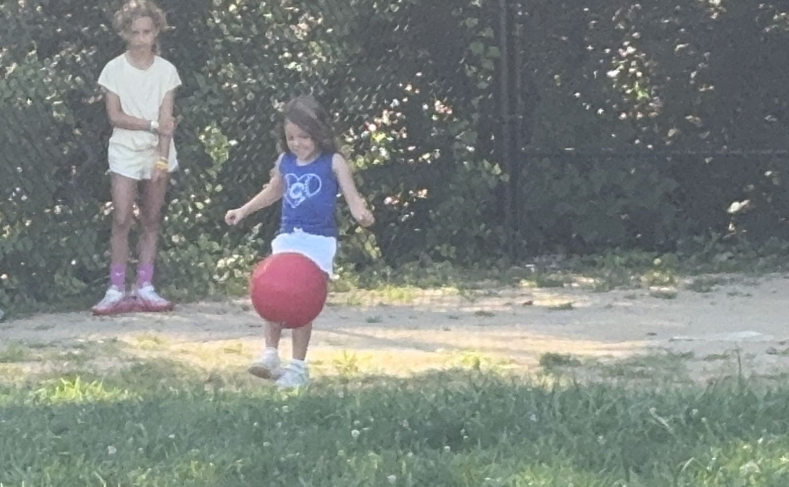 Nora showing the bigs kids how to play