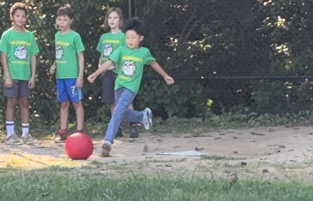 Sean doesn't let jeans affect his ability to kick a ball