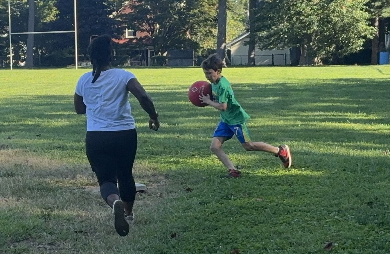 Finda and Dominic in a race to first base